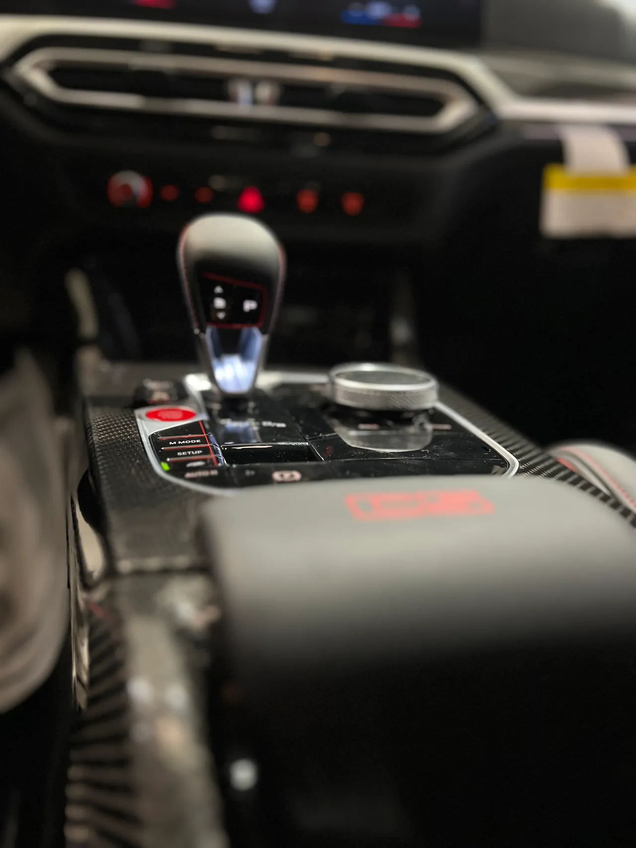 Center console, gear selector and carbon trim of a performance car